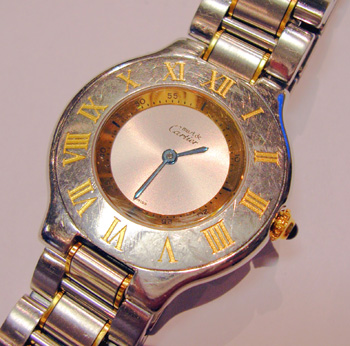 Bicolour <b>Cartier</b> Must 21 quartz bracelet watch, bargain because bezel sli