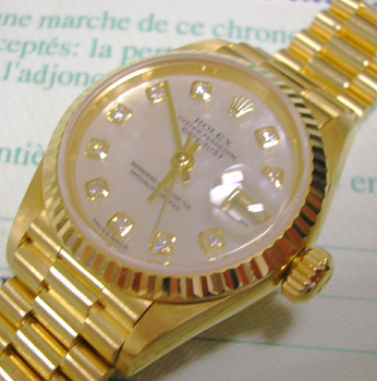 Very recent 18ct lady's Datejust with beautiful, original mother-of-pearl / diam