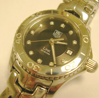 Very pretty lady's <b>TAG Heuer</b> quartz LINK model with black / DIAMOND dial.