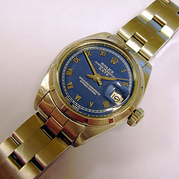 Lady's stainless steel Oyster Perpetual Date model 6919. This is a plastic glass