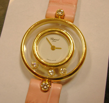 Lady's <b>Chopard</b> "Happy Diamonds" quartz watch on a NEW pink Chopard strap.