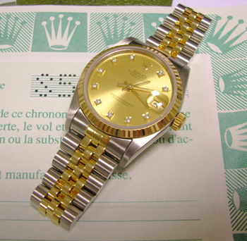 1990s mid-size Datejust with original diamond dial and Rolex papers.