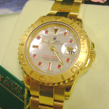 18ct lady's Yachtmaster with ORIGINAL Mother-of-Pearl / Ruby dial, boxes & manua
