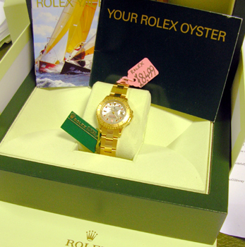 18ct lady's Yachtmaster with ORIGINAL Mother-of-Pearl / Ruby dial, boxes & manua